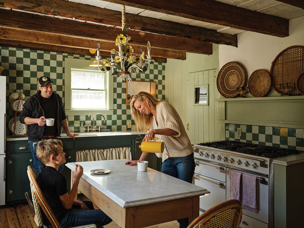 Christina Salway and John Moskowitz with family in the renovated kitchen of their circa 1800s farmhouse in Sedgewick, Maine